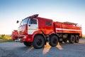 Red airfield firetruck at the morning airport