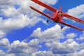 Red airplane biplane with piston engine Royalty Free Stock Photo