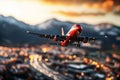 red airplane flying over cityscape at sunset, with mountains in background and blurred lights below, creating vibrant and dynamic Royalty Free Stock Photo