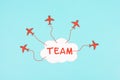 Red airplanes flying out of a cloud, brainstorming for ideas in a team, startup in business, having a goal, positive mindset