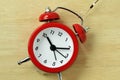 Red alarm clock with fishing hook - Concept of stealing time Royalty Free Stock Photo