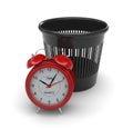 Red alarm clock next to the trash can Royalty Free Stock Photo