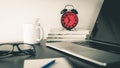 Red Alarm Clock on office table Royalty Free Stock Photo