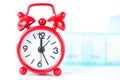 Red alarm clock and pill box background show medicine time Royalty Free Stock Photo