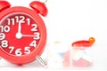 Red alarm clock and pill box Royalty Free Stock Photo
