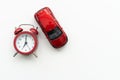 red alarm clock and toy car, the concept of buying a new car Royalty Free Stock Photo