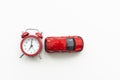 red alarm clock and toy car, the concept of buying a new car Royalty Free Stock Photo