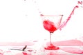Red alcohol cocktail drink splash on white background. Royalty Free Stock Photo