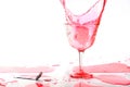 Red alcohol cocktail drink splash on white background. Royalty Free Stock Photo