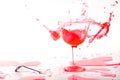 Red alcohol cocktail drink splash on white background. Royalty Free Stock Photo