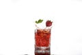 Red alcohol cocktail with splash, strawberry and mint leaf isolated on white Royalty Free Stock Photo