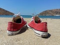 Red All Star converse on sand Royalty Free Stock Photo