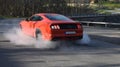 Red American muscle car burnout