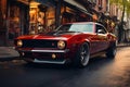 A red American muscle car, unbranded, speeds through a city road Royalty Free Stock Photo