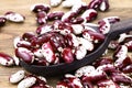 Red Anasazi Beans isolated on a wooden background. Spotted beans.Kidney beans.Haricot beans. Vegetarian food. Healthy protein food