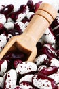 Red Anasazi Beans and wooden scoop. Spotted beans.Kidney beans.Haricot beans. Vegetarian food. Healthy protein food.Vertical Royalty Free Stock Photo