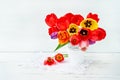 Red ans yellow tulips bouquet in white vase on white background. Royalty Free Stock Photo