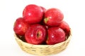 Red apple in bamboo basket on white background Royalty Free Stock Photo