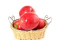 Red apple in bamboo basket on white background Royalty Free Stock Photo