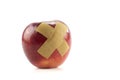 Red apple with bandage Royalty Free Stock Photo