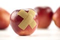 Red apple with bandage Royalty Free Stock Photo