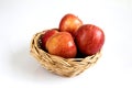 Red apple in basket on white background Royalty Free Stock Photo