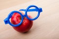 Red Apple blue glasses wooden table