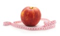 Red apple with a centimeter tape Royalty Free Stock Photo