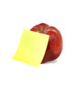 Red apple with clear yellow notepaper