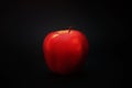 Red apple on a black background