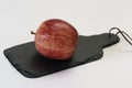 Red apple on a cutting graphit board Royalty Free Stock Photo