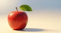 Red apple with droplets on its surface rests on a neutral background. A single green le Royalty Free Stock Photo