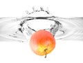 Red apple falling into water Royalty Free Stock Photo