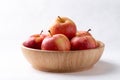 Red apple fruit (Gala apple) in wooden bowl on white background Royalty Free Stock Photo