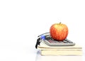 Red apple fruits on book stack and calculator and glasses with horizaltal Royalty Free Stock Photo