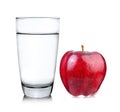 Red apple and glass of water on white background Royalty Free Stock Photo