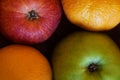 Red apple, green apple and two oranges in composition Royalty Free Stock Photo