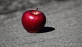 A red apple on the ground