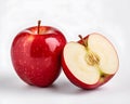 Red apple halves and red apple fruit high detail on white background.