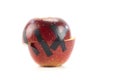 Red apple halves held together by black tape