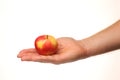 Red apple in hand on a white background isolate Royalty Free Stock Photo