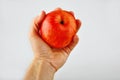 Red apple in a hand Royalty Free Stock Photo