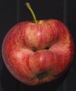 Red apple of irregular shape