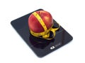 Red apple on kitchen scales with measuring tape isolated closeup Royalty Free Stock Photo