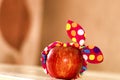 Red apple with a large background, an apple is lying on a table, an apple in a bandage, a funny apple, minimalism