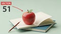 Red apple with leaf placed on an open book with a blue cover Royalty Free Stock Photo