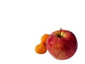 Red apple, mandarins blurred Royalty Free Stock Photo