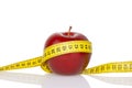 Red apple with measure tape Royalty Free Stock Photo