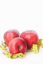 Red Apple with Measure Tape for Loose Weigh, diet and fitness with copy space . Isoalted on White Background. Vertical image. Royalty Free Stock Photo