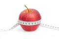 Red Apple with measure tape on white Royalty Free Stock Photo